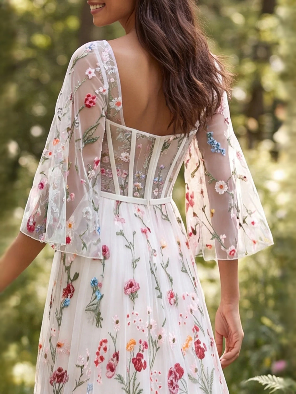 Ivory floral tulle dress detail: corset bodice, scalloped square neckline, sheer sleeves
