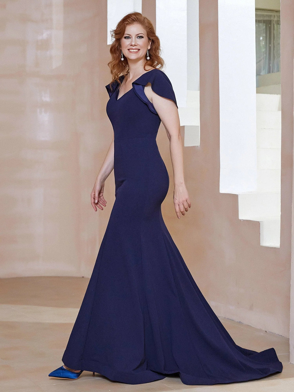 Dark navy ruched v-neck mermaid maxi dress with draped bodice and flutter ruffle sleeves