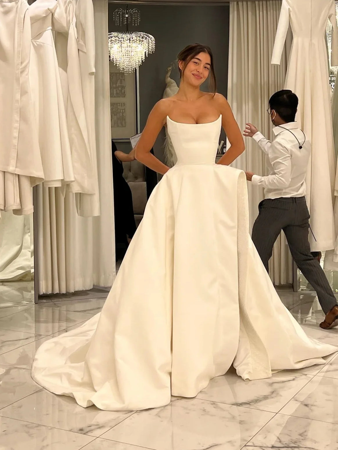 White satin strapless A-line wedding dress with sweetheart neckline and draped bodice