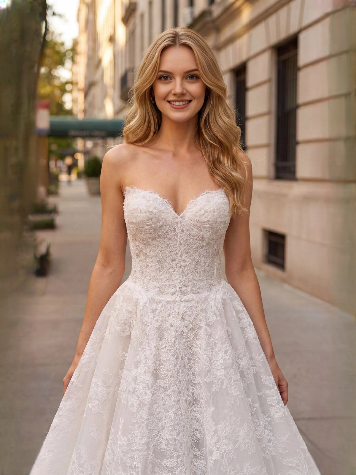 Ivory tulle sweetheart A-line wedding dress with lace bodice and flowing full skirt