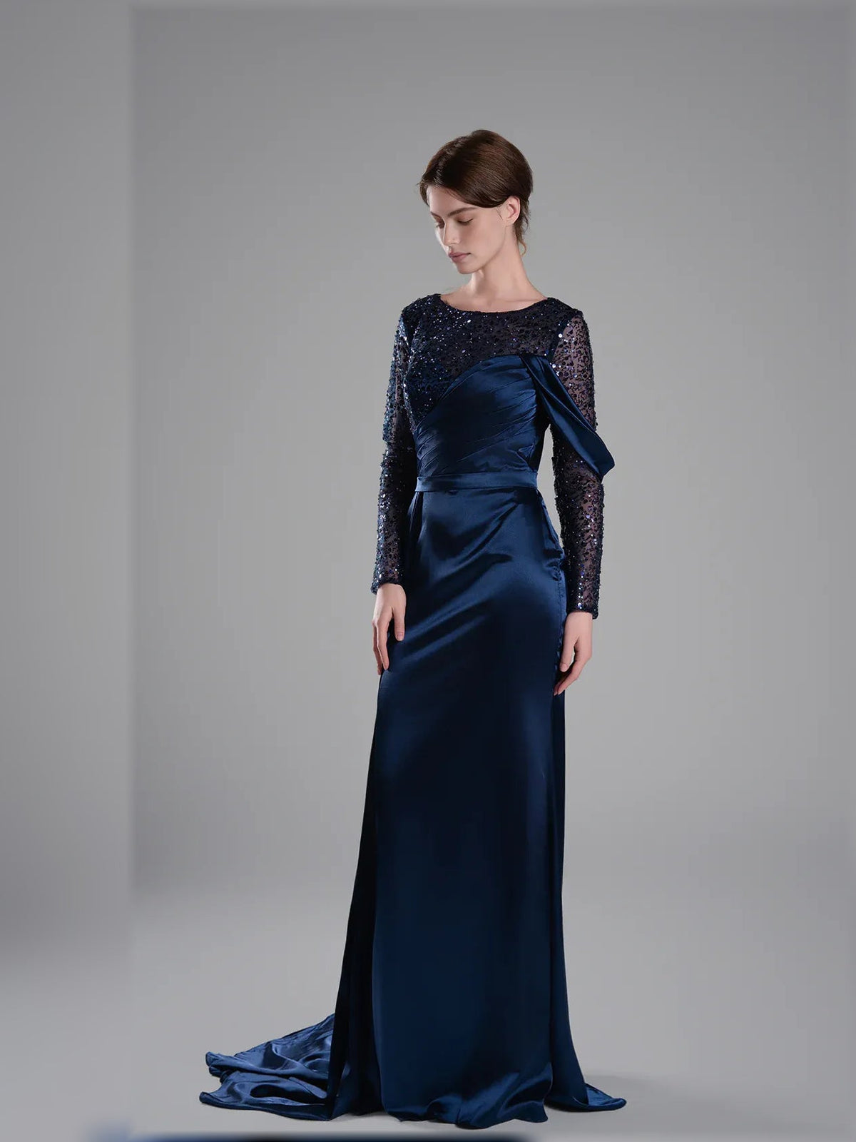 Navy blue floor-length formal dress with long beaded sleeves and satin-like skirt