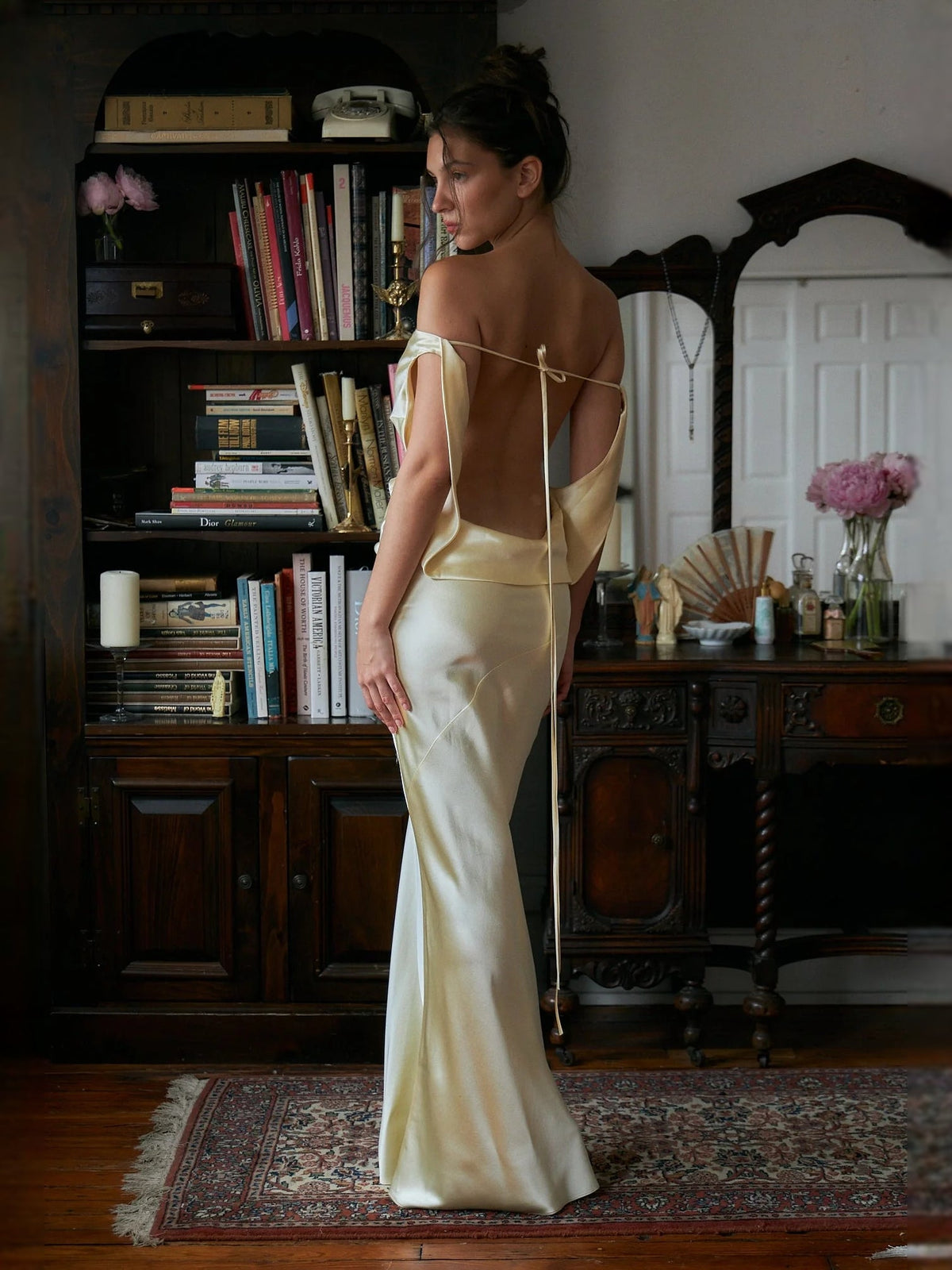 Ivory satin mermaid prom dress, open back with crisscross straps and slim silhouette.
