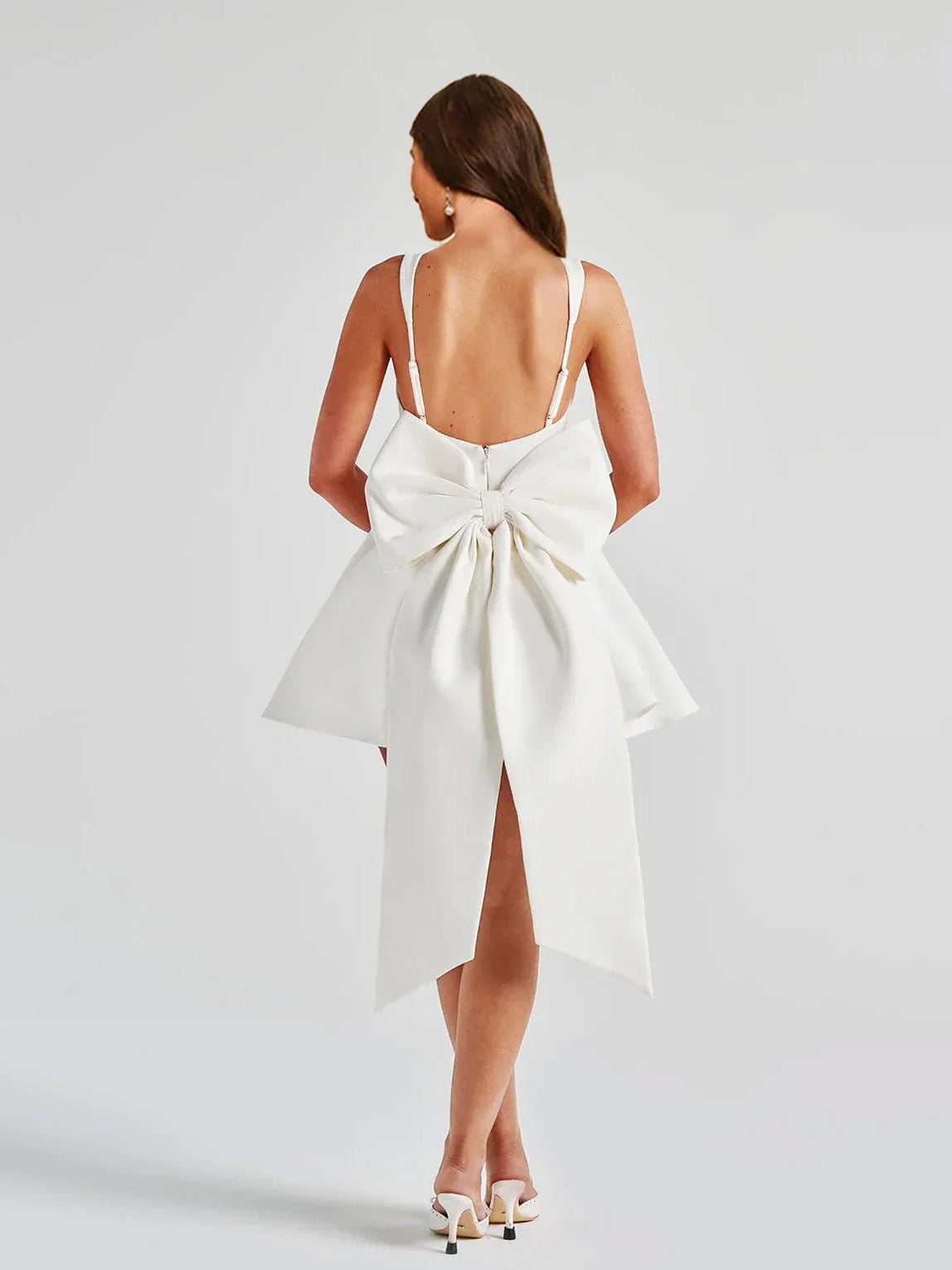 Ivory open-back A-line mini dress with corset straps and bow at waist
