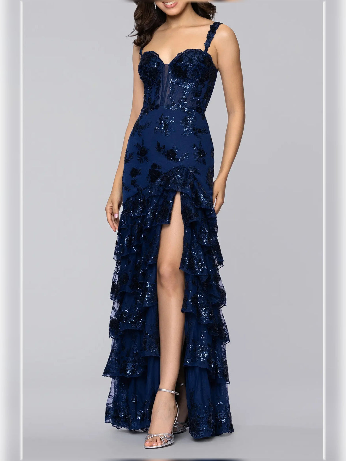 Navy blue floral print sweetheart formal dress with spaghetti straps and layered ruffle skirt