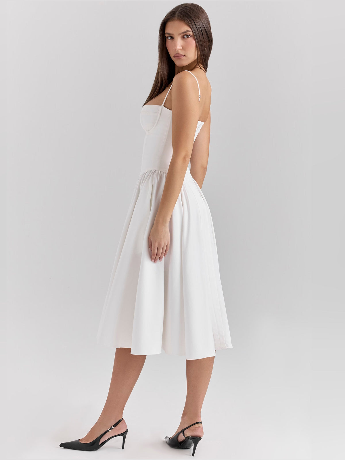 White corset midi formal dress with low-back design and spaghetti straps