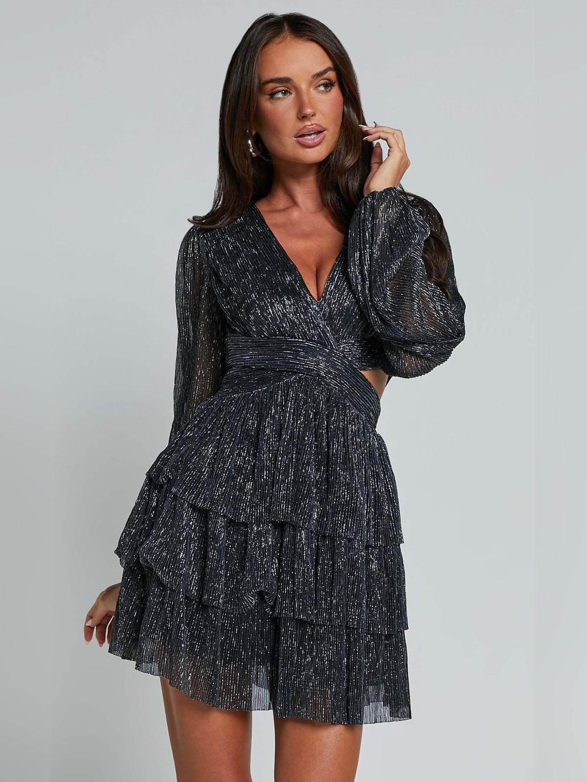 Black long-sleeve mini dress with V-neck and layered tiered skirt