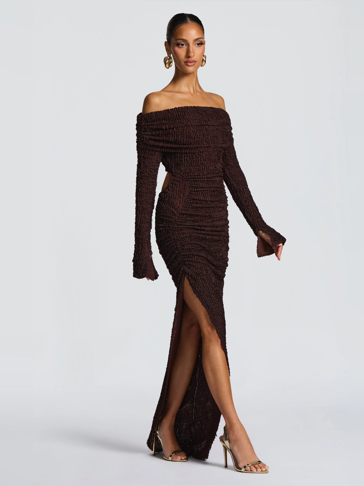 Brown midi formal dress with off-shoulder neckline, long sleeves, and front slit