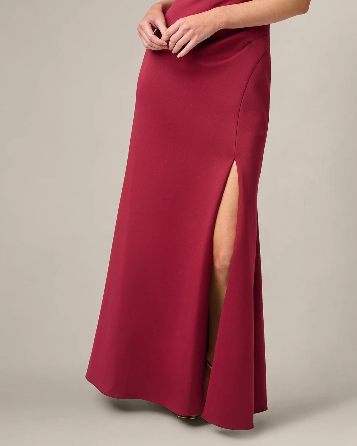 Crimson red mermaid maxi dress with side slit and fitted waist detail