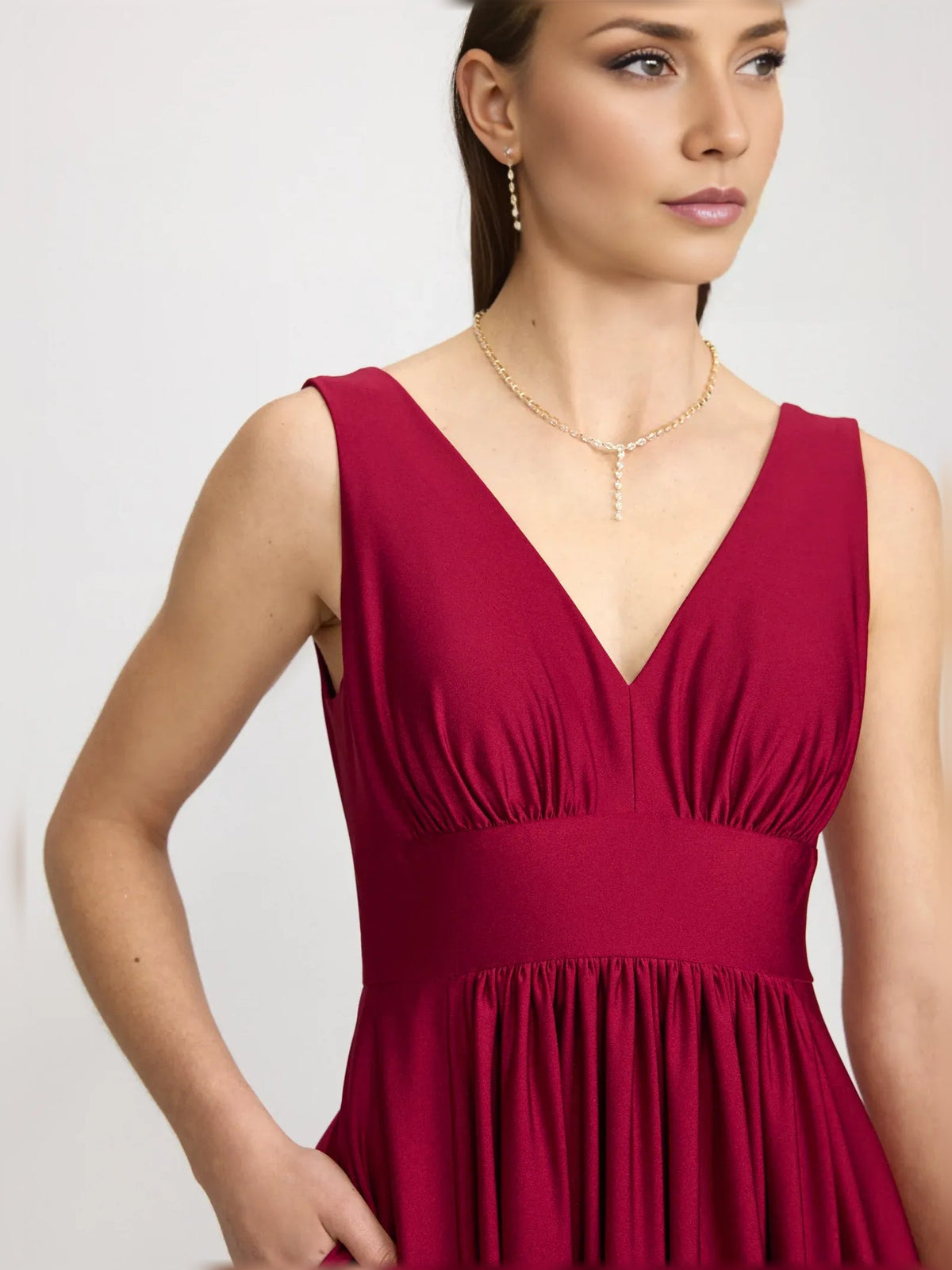 Red V-neck ruched formal dress, sleeveless bodice with gathered waist and necklace