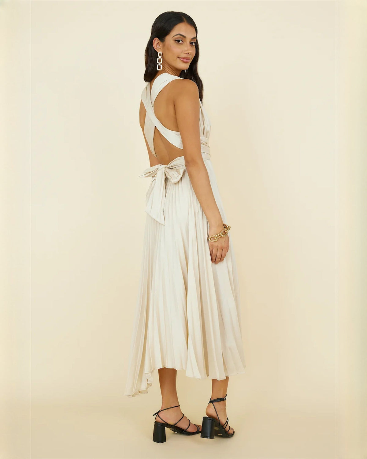 Ivory sleeveless chiffon midi dress with crisscross open back and draped tie detail