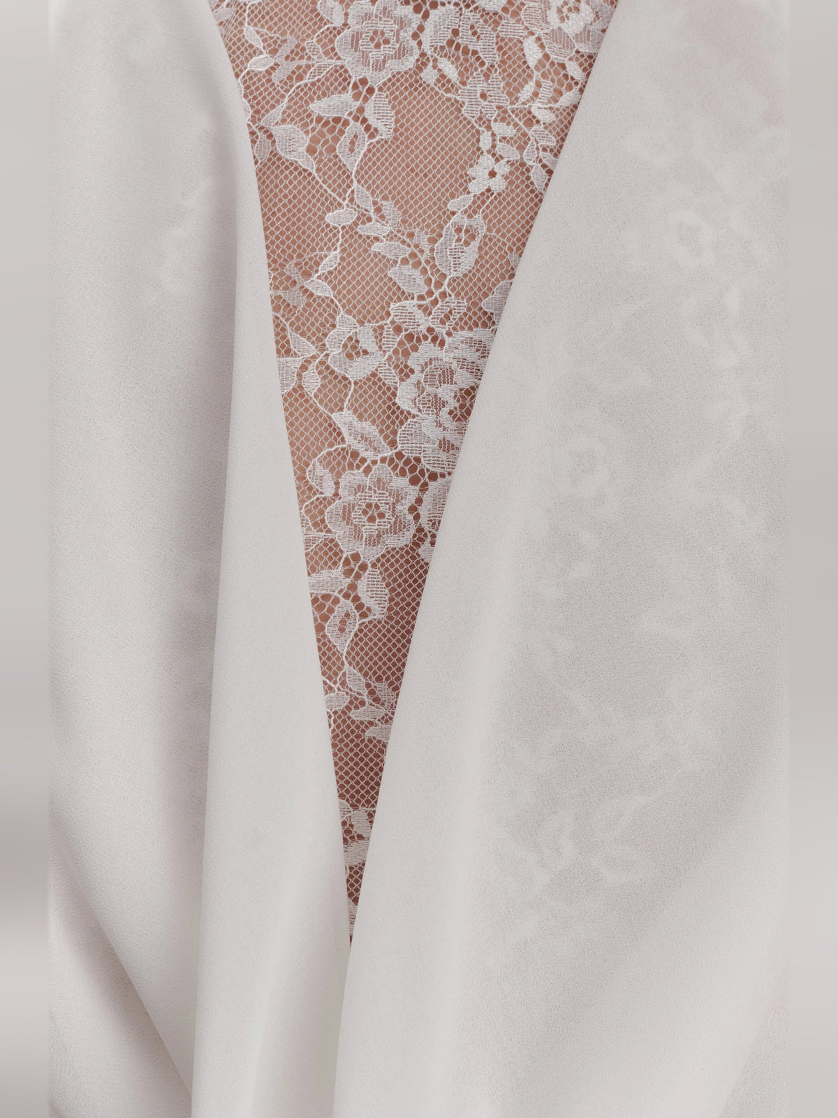White chiffon dress with sheer lace triangular halter panel