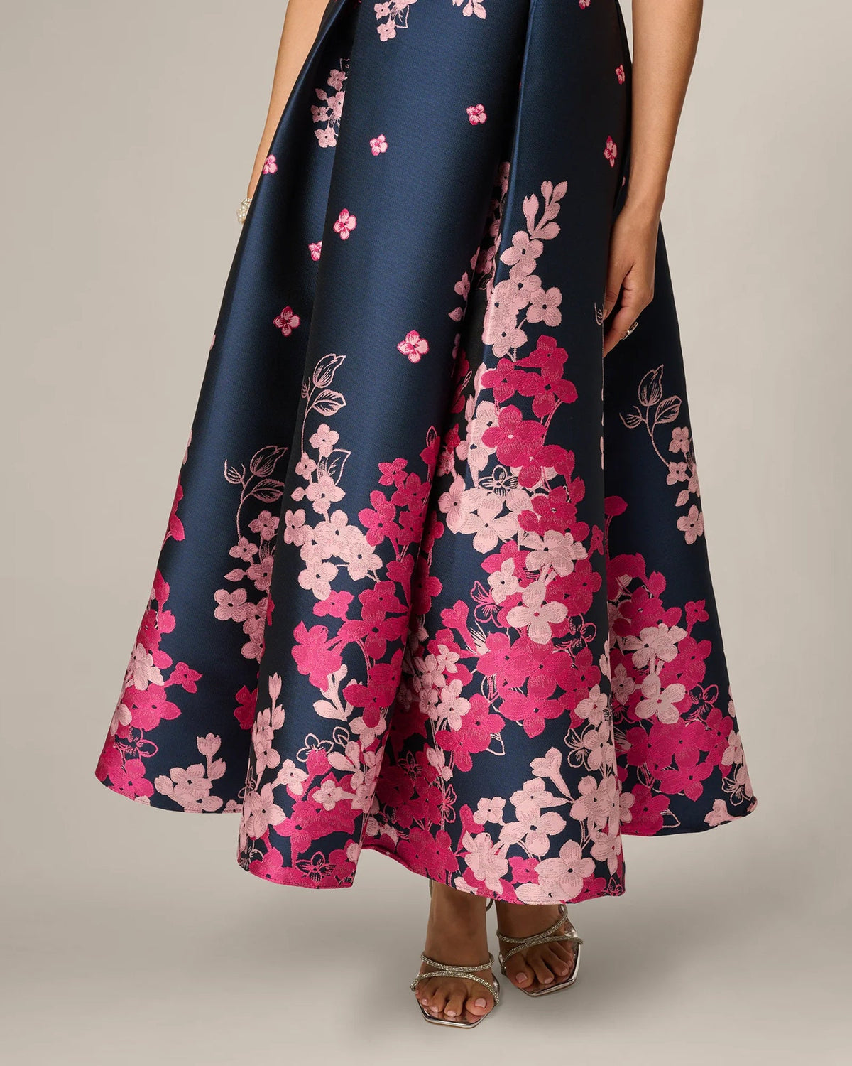 Navy A-line maxi skirt with dense pink floral print and wide hem