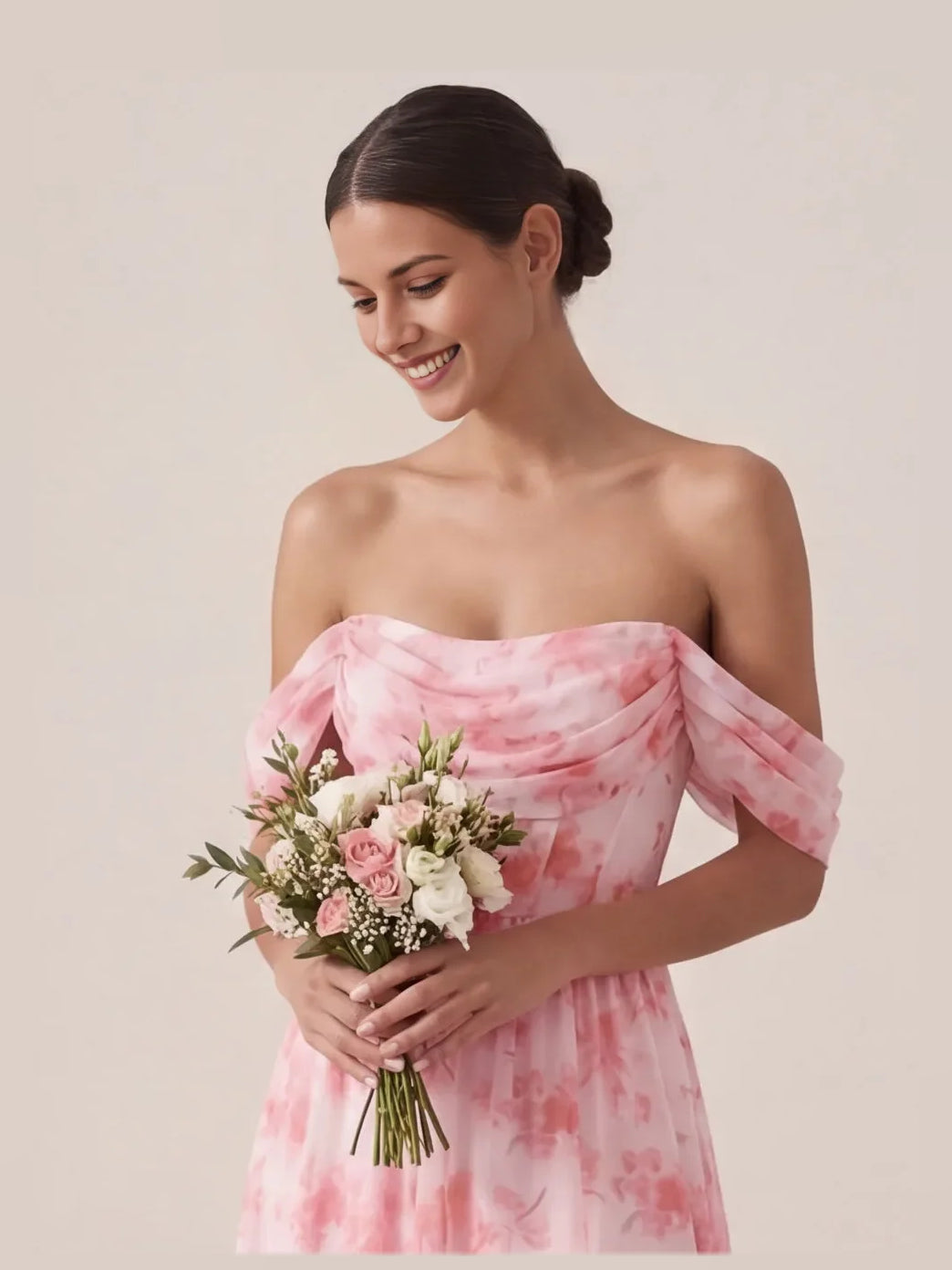 Pink floral off-shoulder corset maxi dress with draped sleeves, holding a bouquet