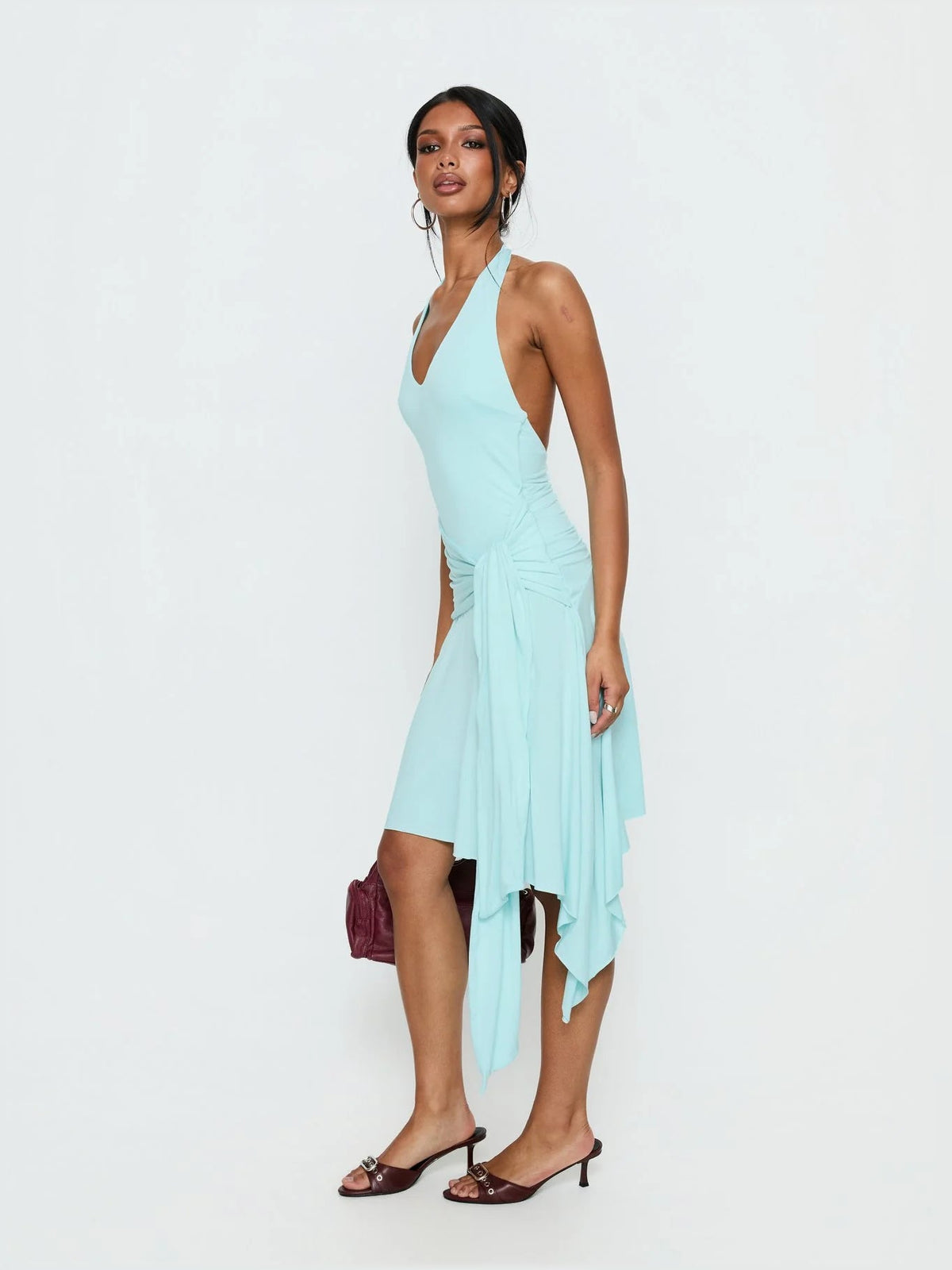 Turquoise halter jersey midi dress with V halter neckline and side fluttering drape