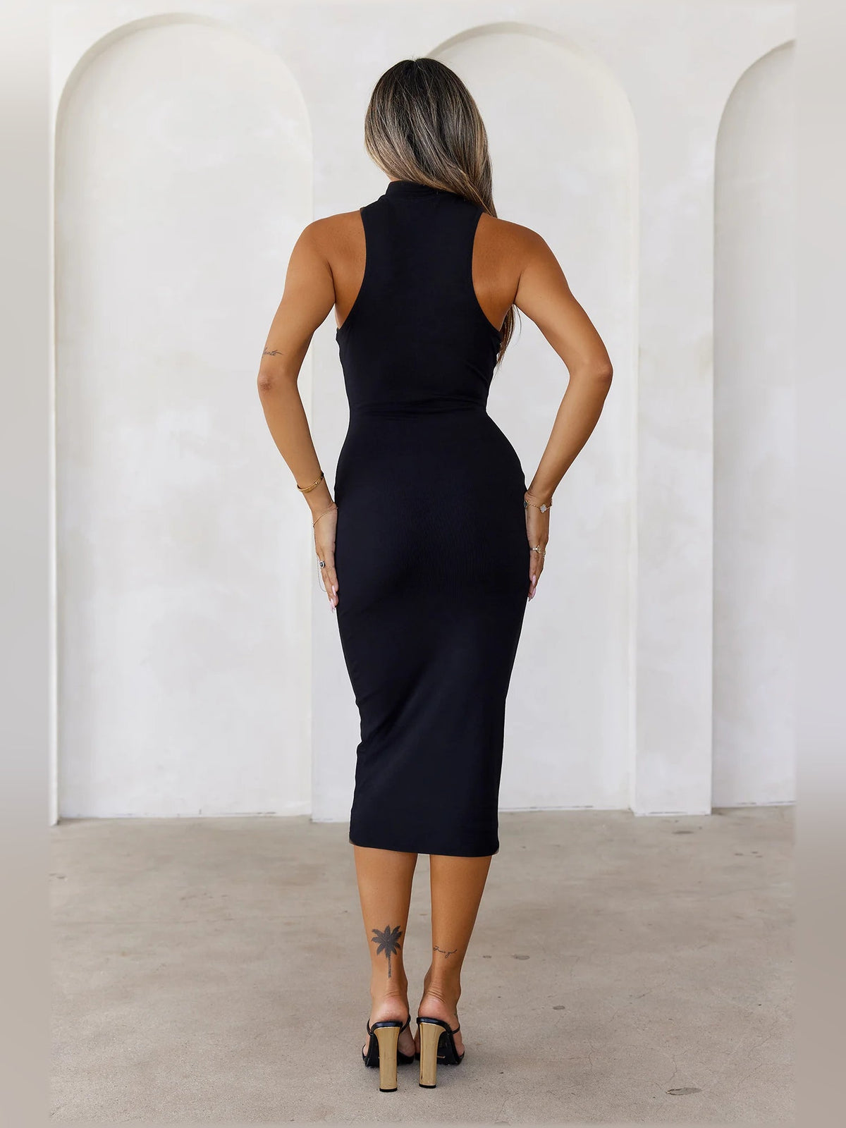 Black ribbed high-neck bodycon midi dress, sleeveless back view
