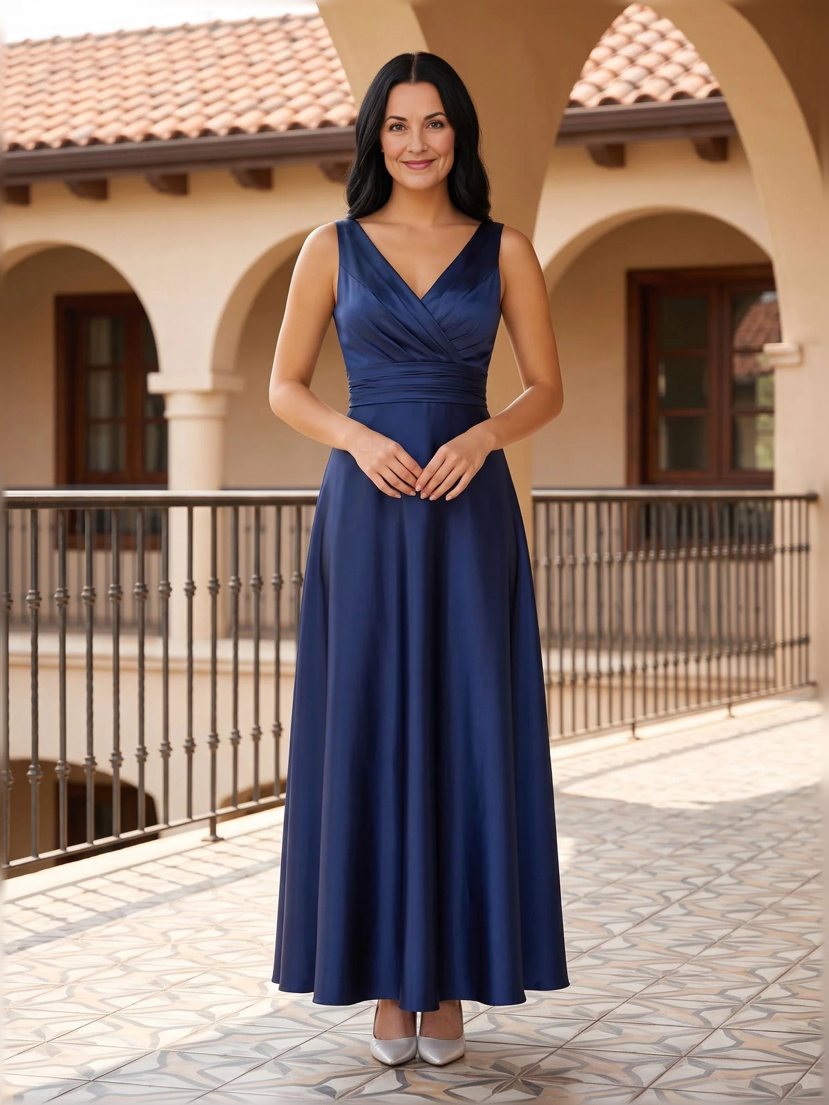 Dark blue satin sleeveless V-neck ruched A-line floor-length dress, hands at waist