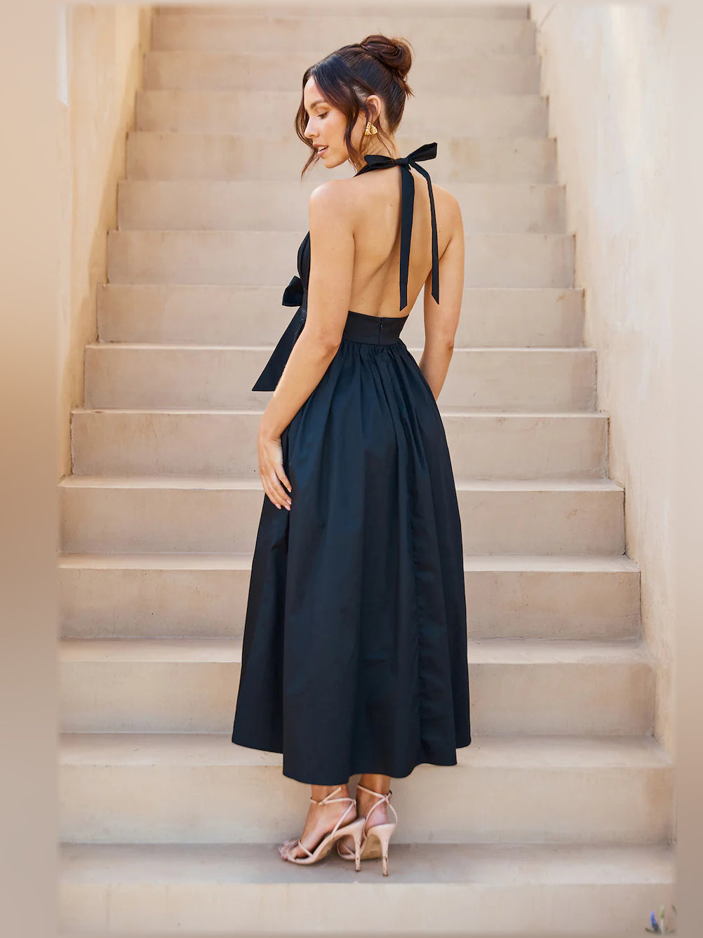 Black halter midi dress with open back and knot tie straps