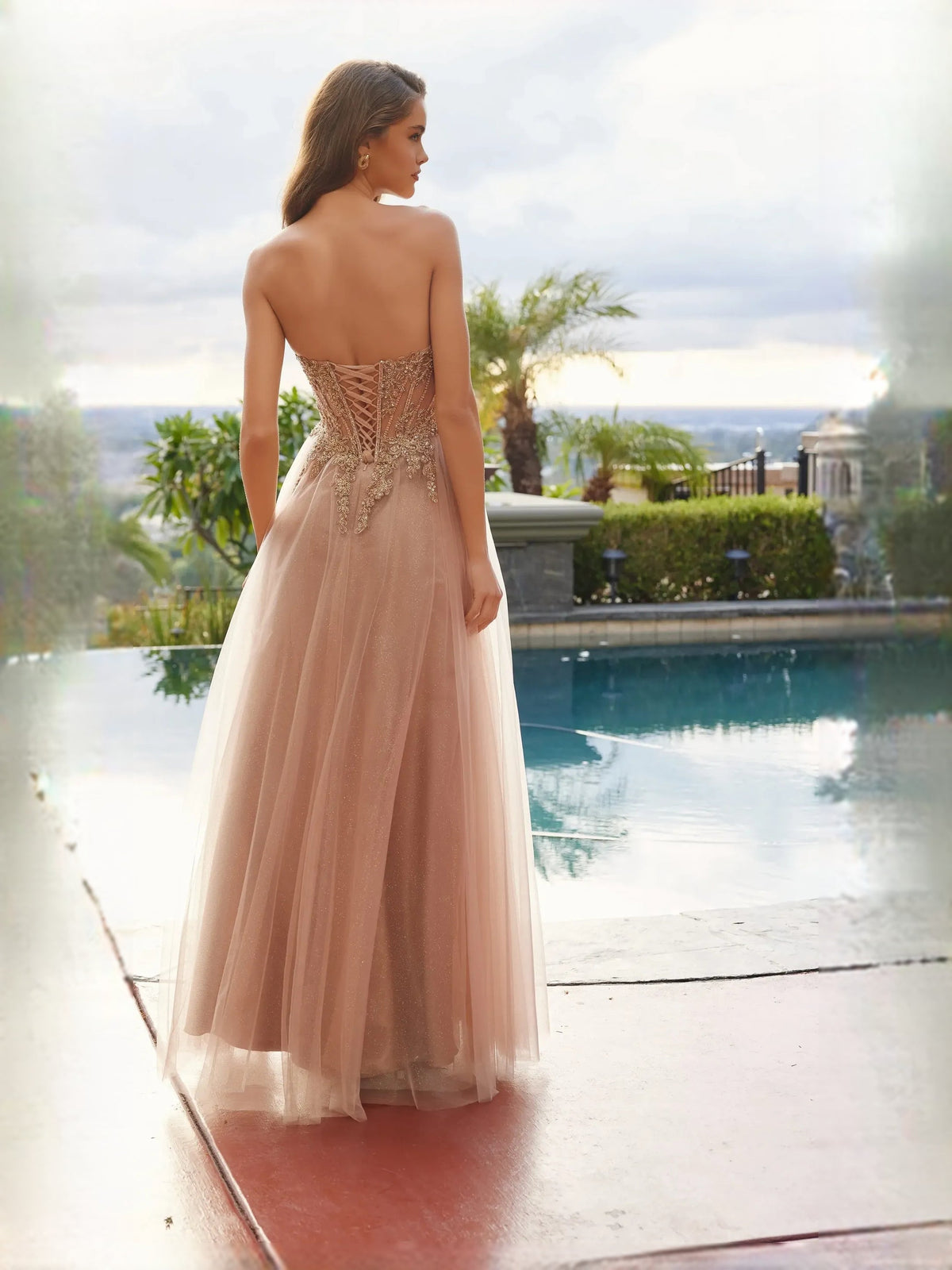 Nude corset prom dress with open back, floral beadwork, front slit tulle skirt
