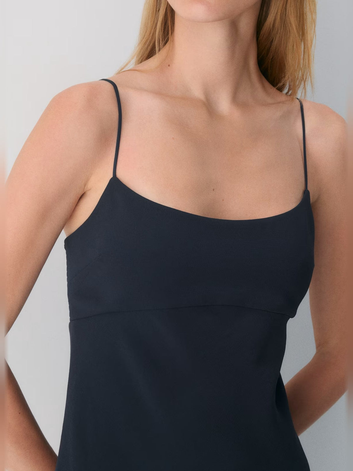 Navy crepe mini dress close-up: spaghetti straps and square neckline