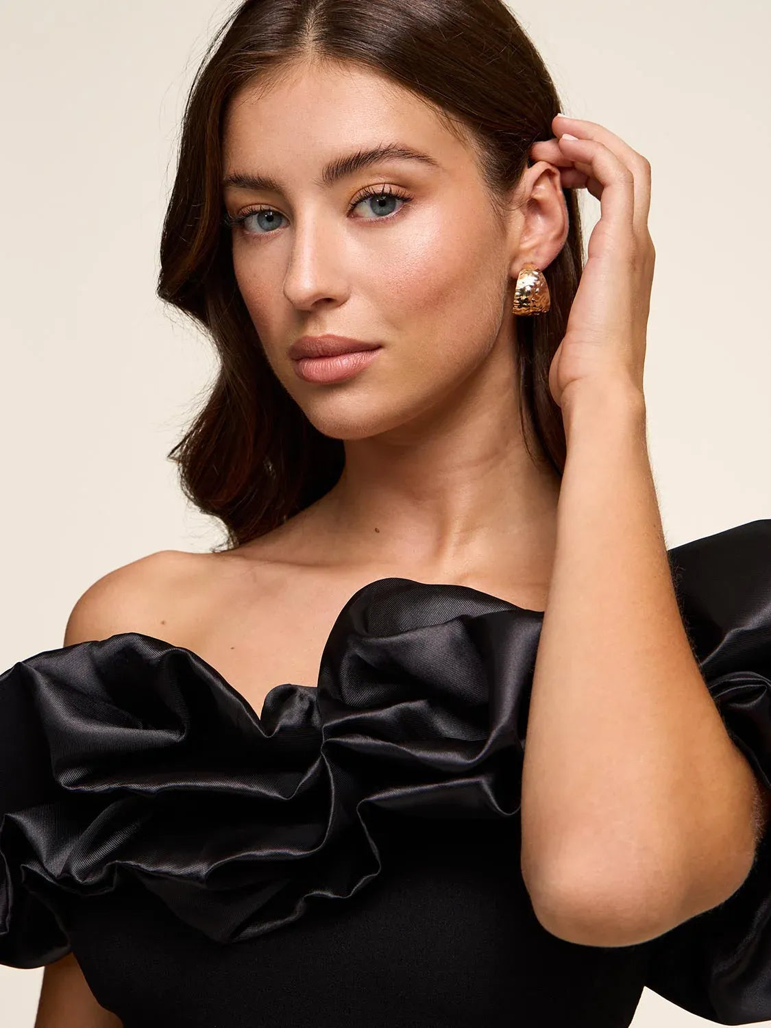 Black off-shoulder ruffled bodice of a formal slit dress