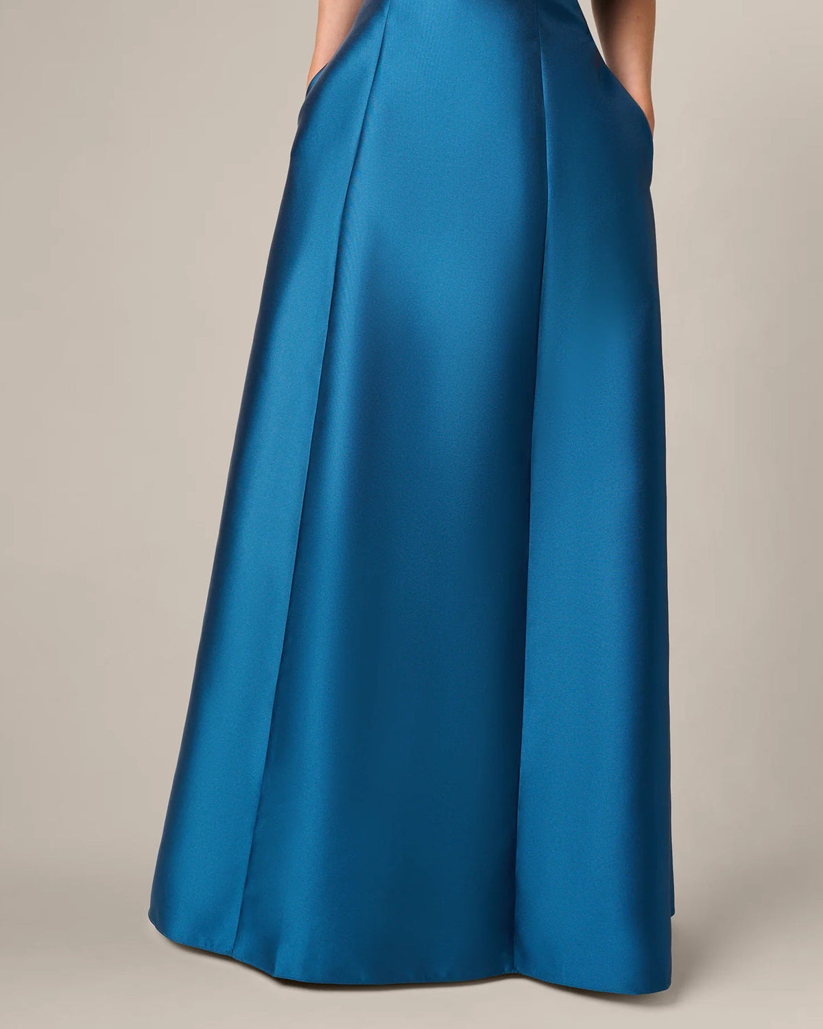 Teal blue A-line maxi skirt with pleated panels and full flowing hem