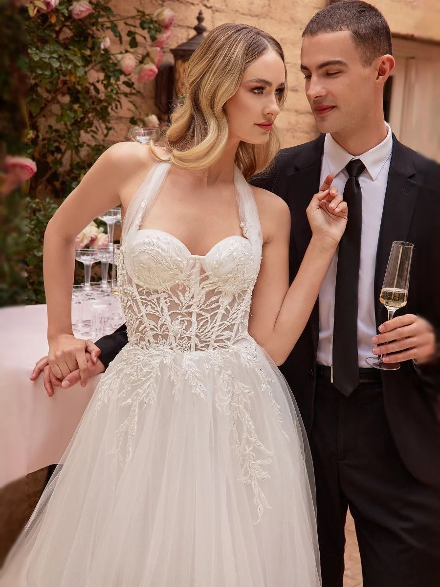 White sweetheart corset wedding dress with floral lace bodice and embroidered overlay