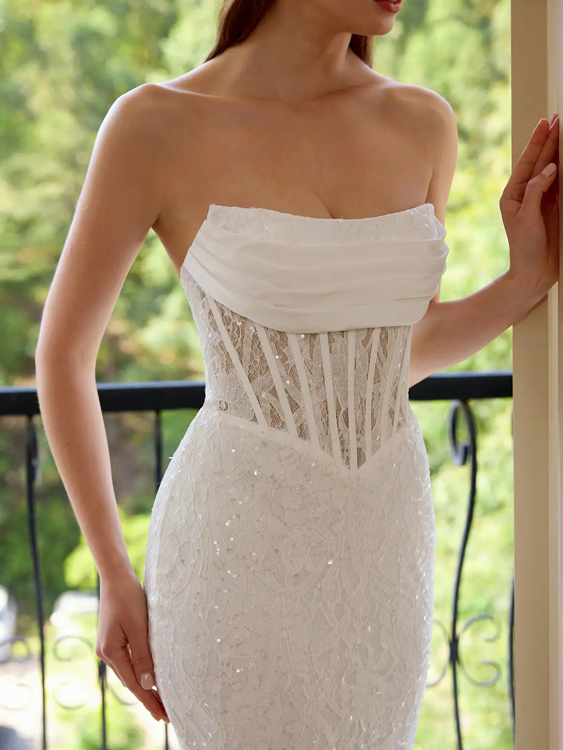 White strapless corset dress with lace-up back detail and textured sweetheart bodice