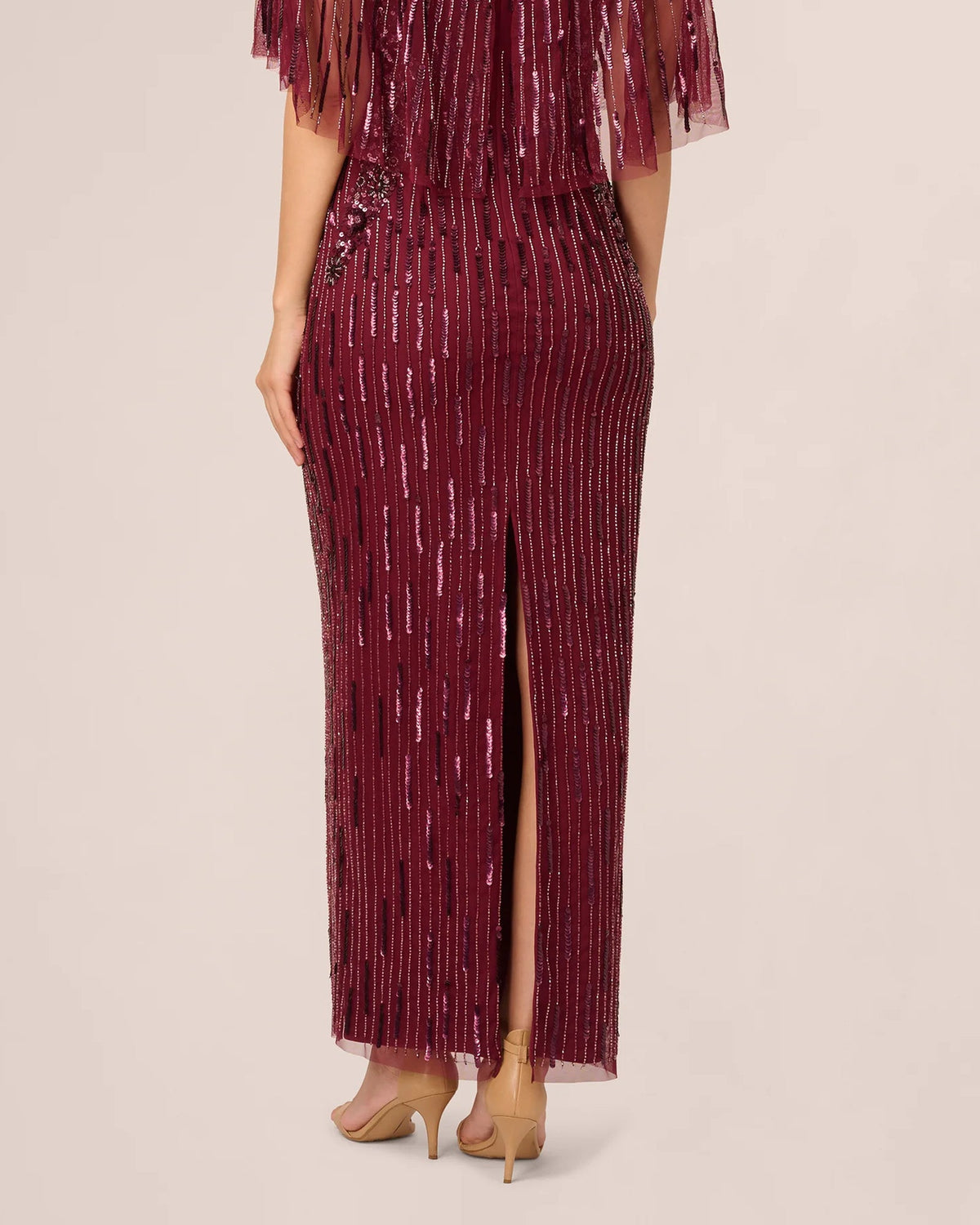 Burgundy sequined maxi sheath dress with front slit and fringe sleeve hem