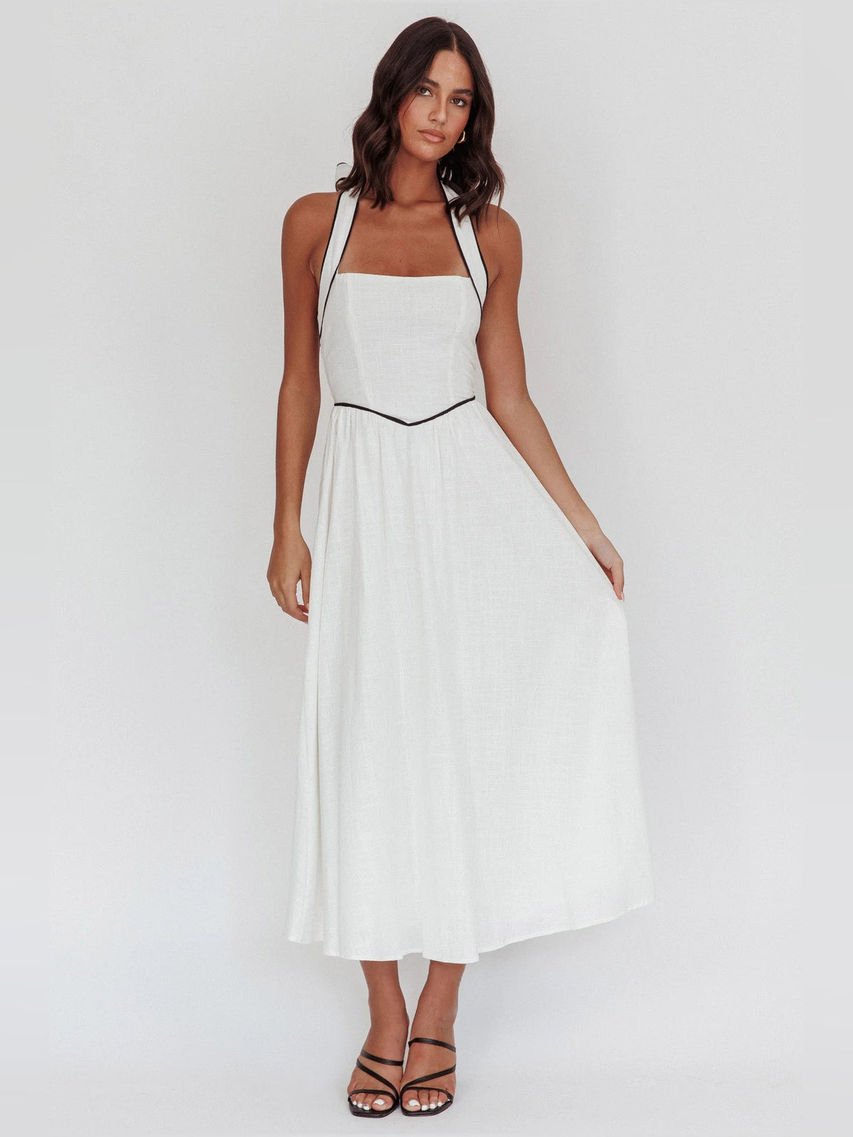 White a-line midi formal dress with halter neckline, alternate view showing the waist