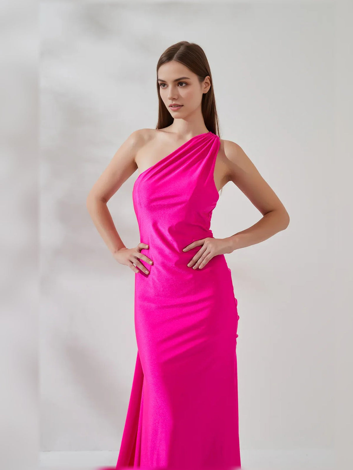 Hot pink one-shoulder mermaid dress with ruched side drape and fitted waist