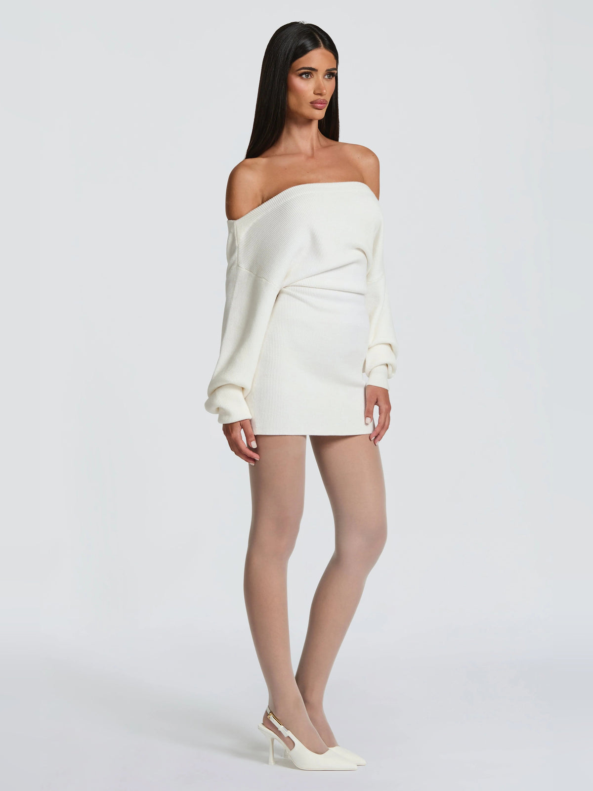 Ivory off-shoulder mini dress with long sleeves and smooth, fitted silhouette