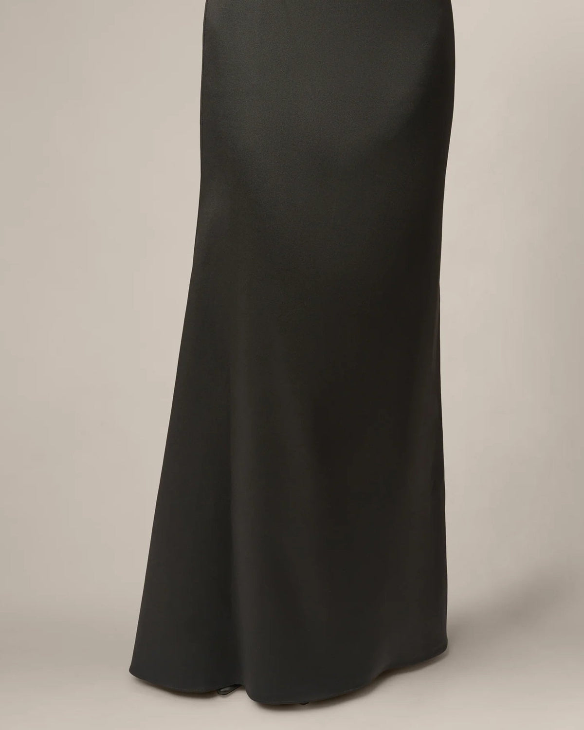 Black mermaid-style maxi skirt with smooth drape and subtle flare