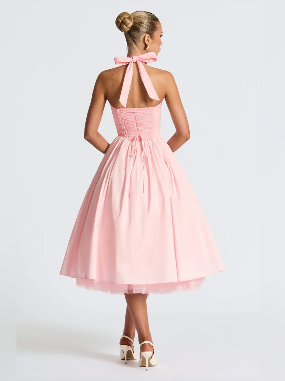 Blush pink halter A-line midi formal dress with open back strap bow and pleated skirt