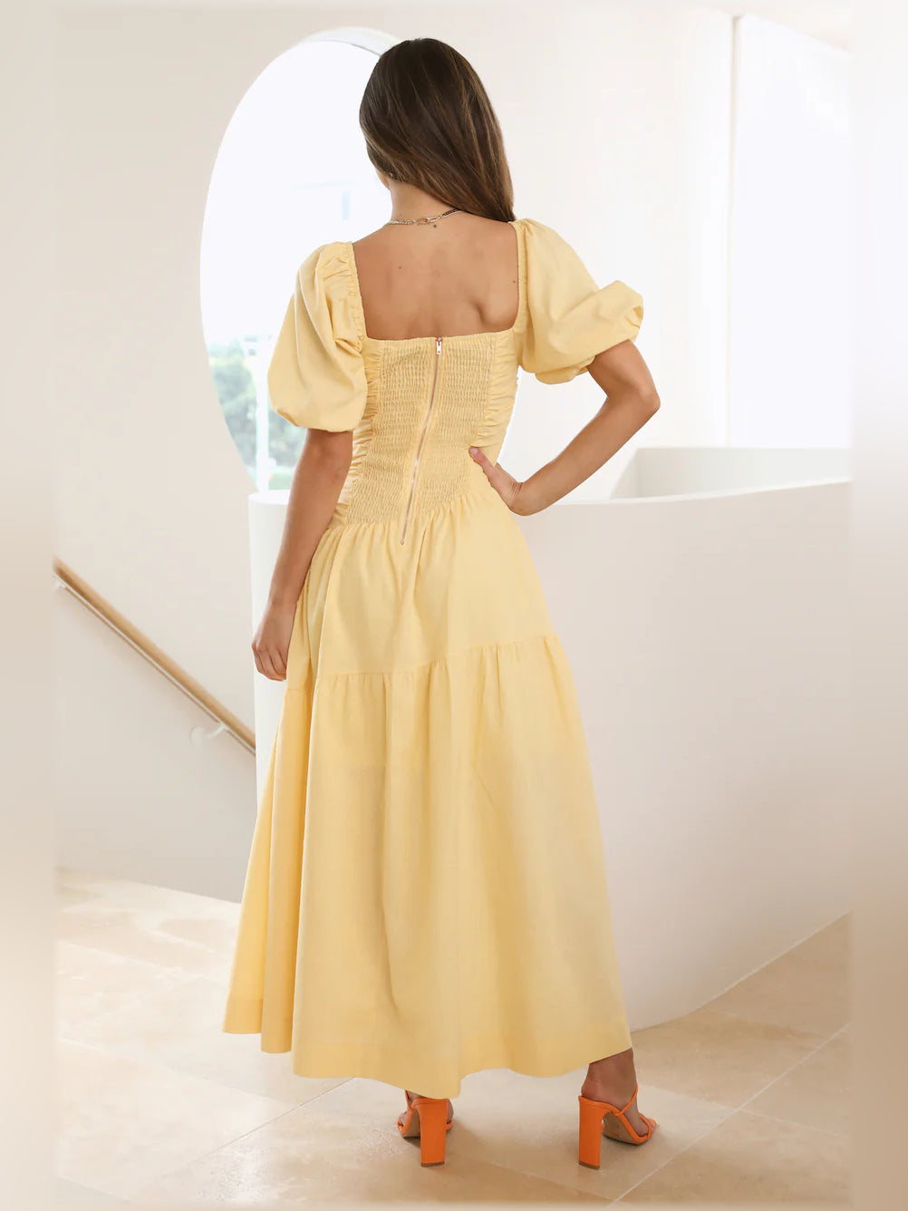 Yellow midi formal dress with square back and puff sleeves, tiered skirt