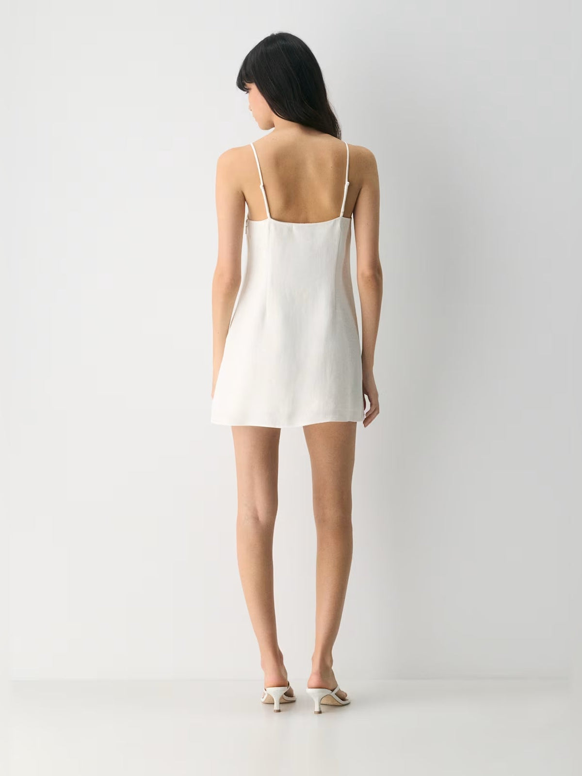 White square-neck mini dress with spaghetti straps, back view