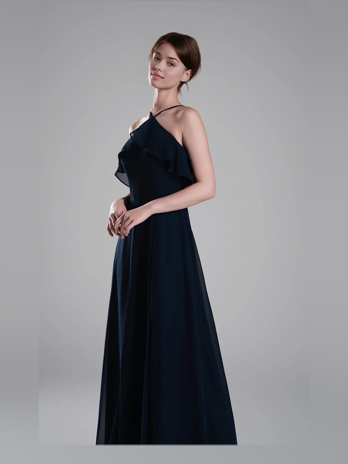 Dark navy chiffon bridesmaid dress with halter neck, ruffled shoulder overlay, and full skirt
