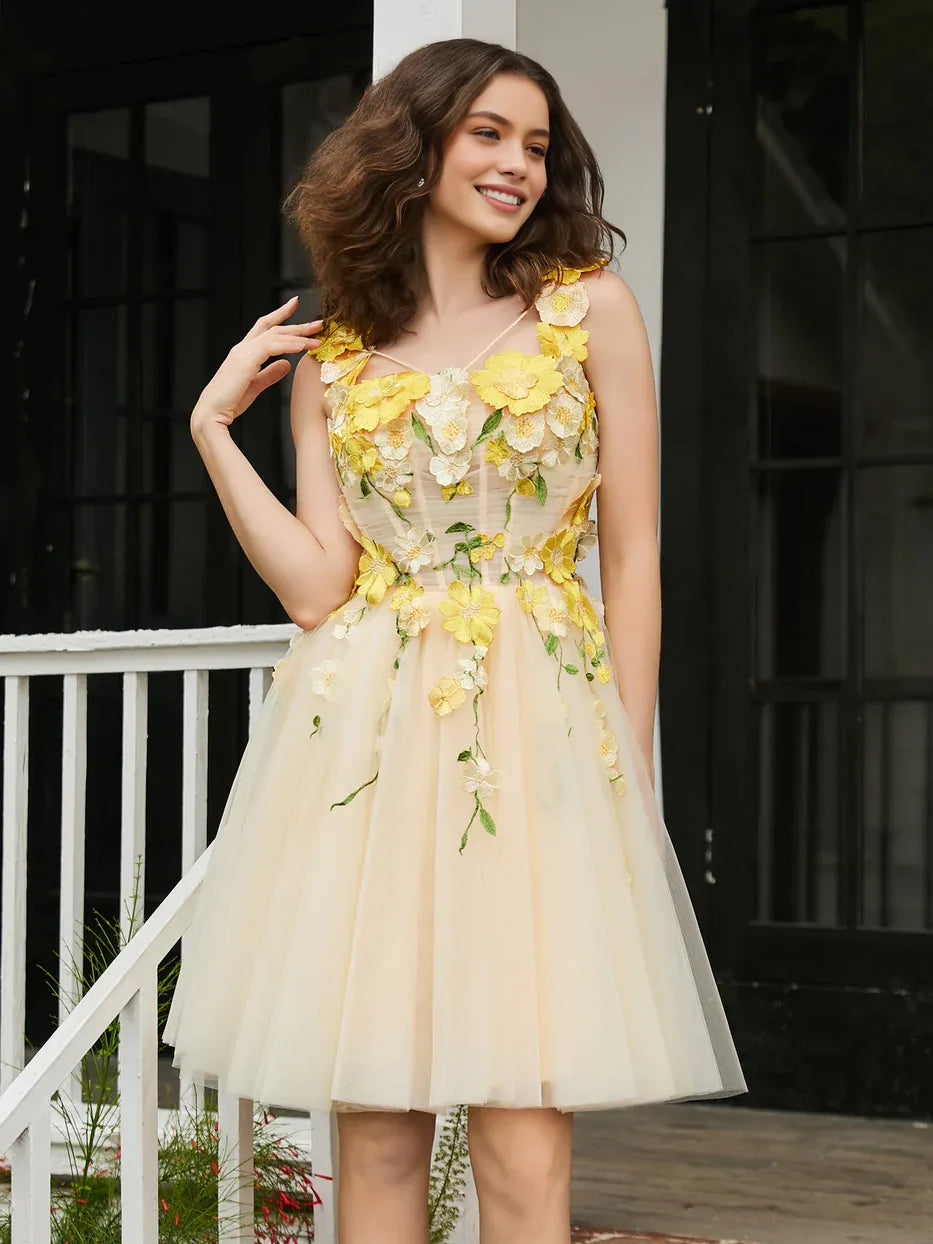 Pale lemon tulle mini dress with square neckline and layered yellow flower applique detail