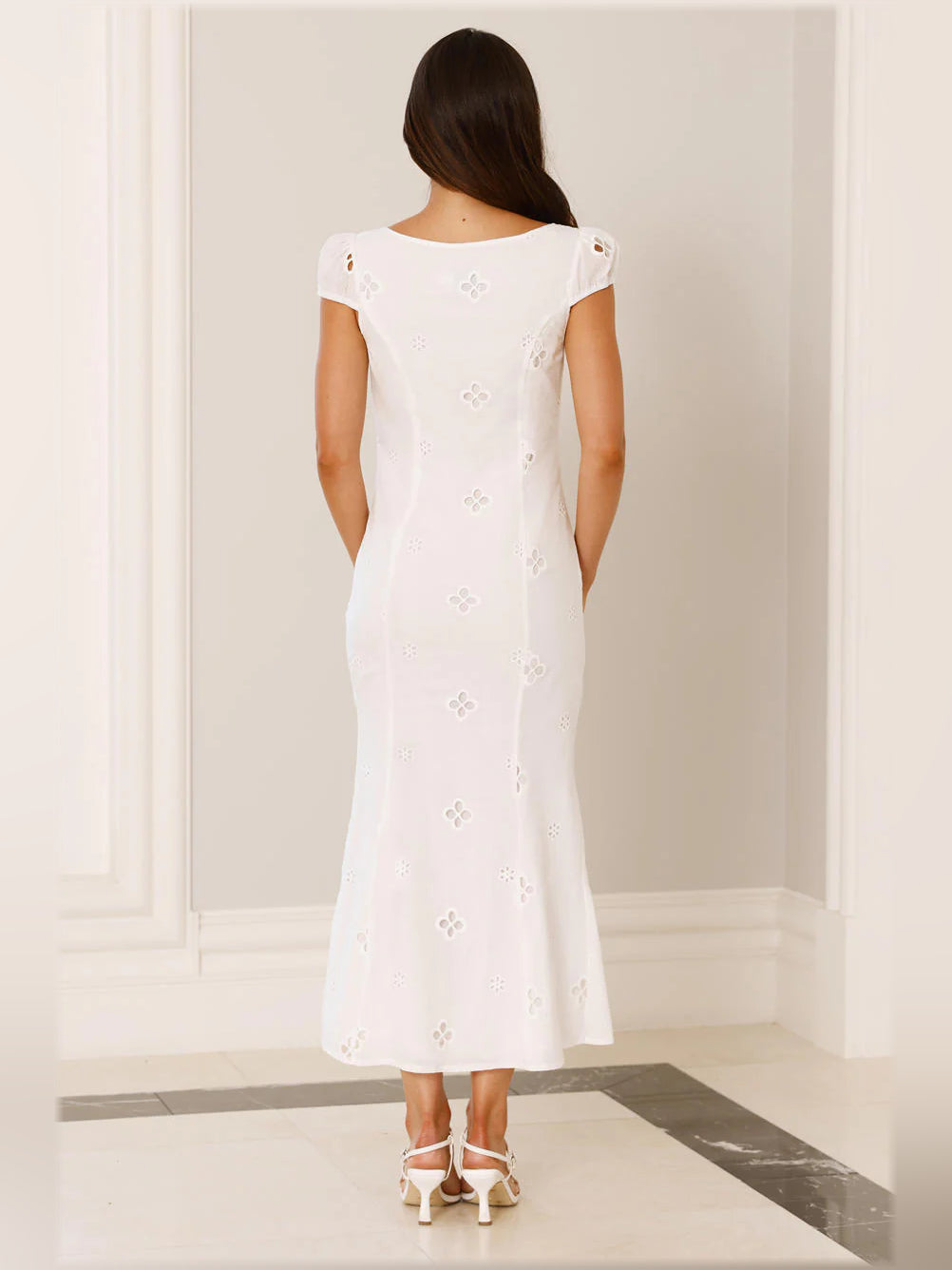 White midi formal dress back view, cap sleeves and openwork eyelet pattern