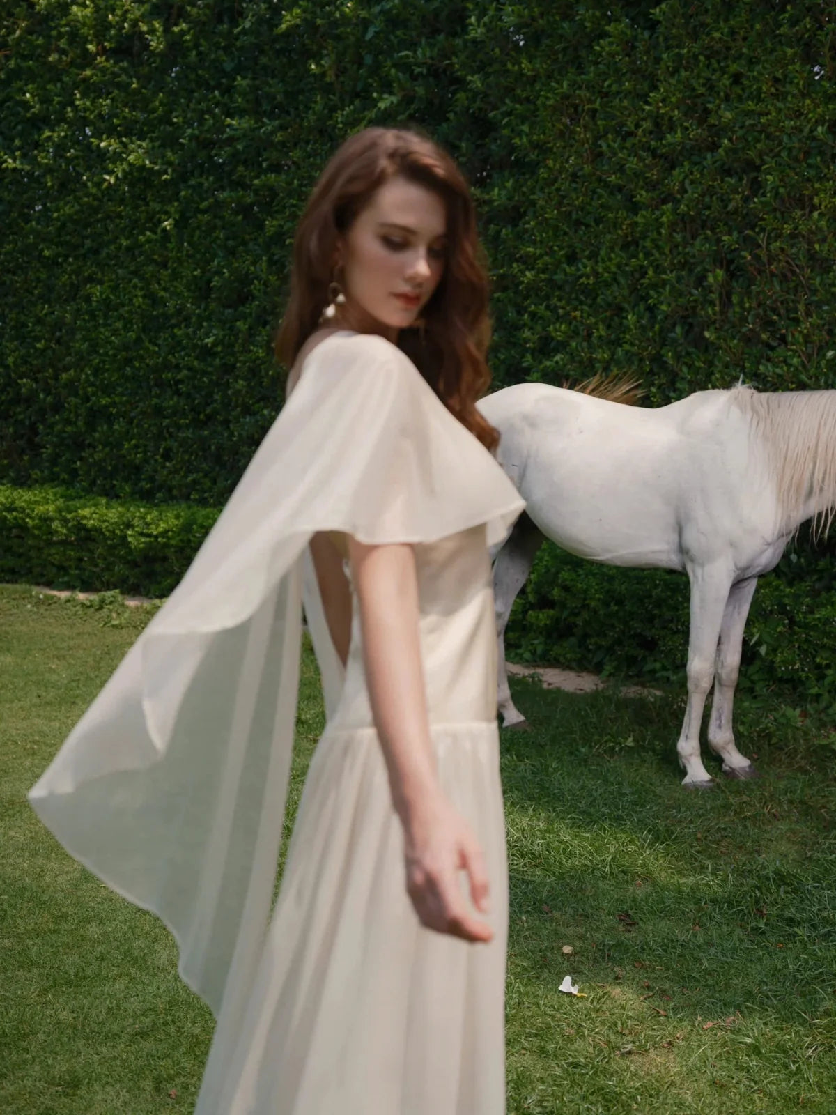 Ivory chiffon halter gown with fluttering drape sleeves and A-line maxi skirt