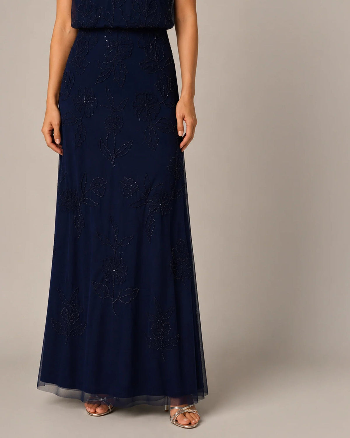 Navy floral embroidered maxi dress with straight neckline and tiered tulle skirt hem
