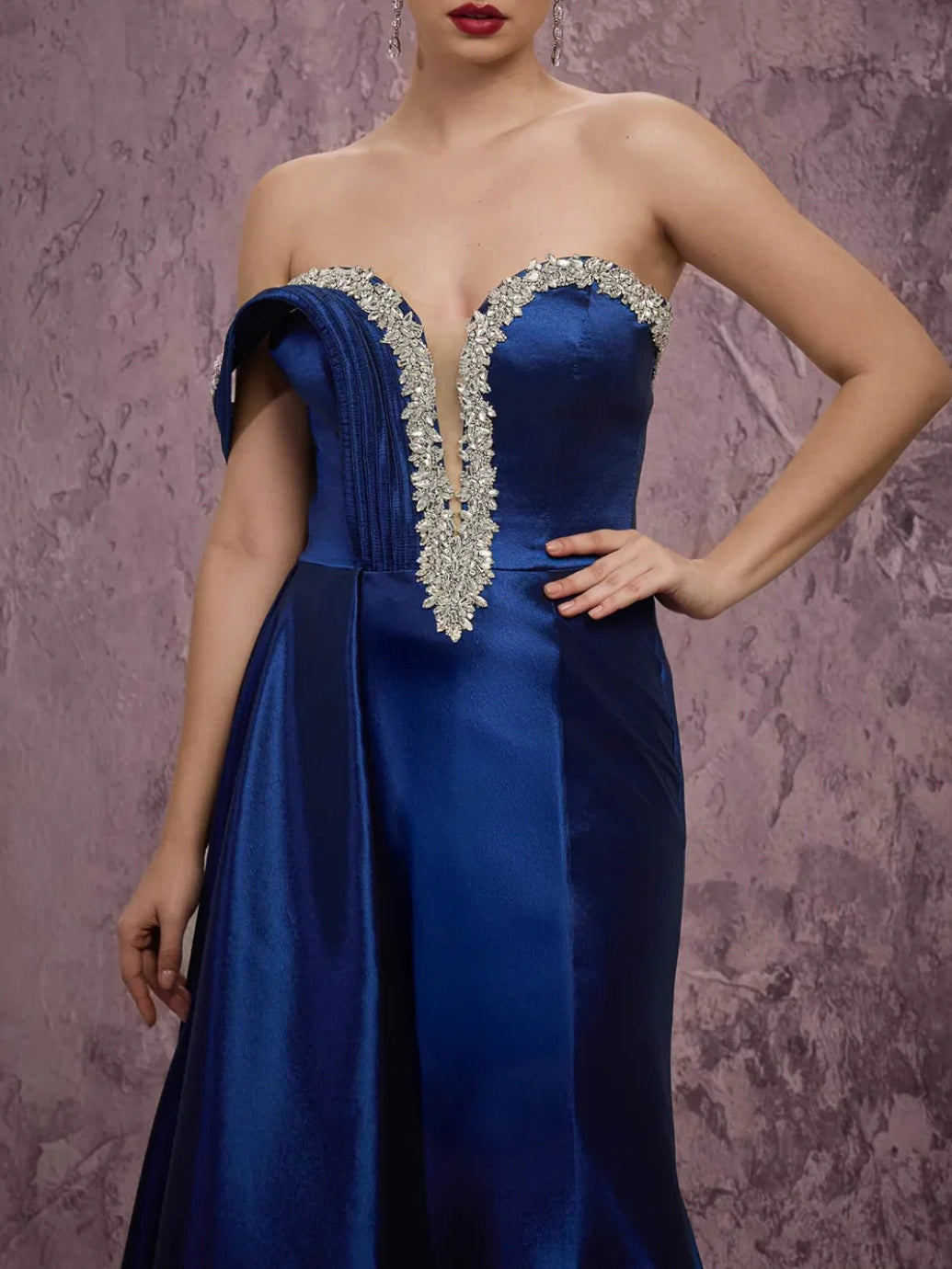 Navy off-shoulder satin gown with silver beaded V bodice and ruched details