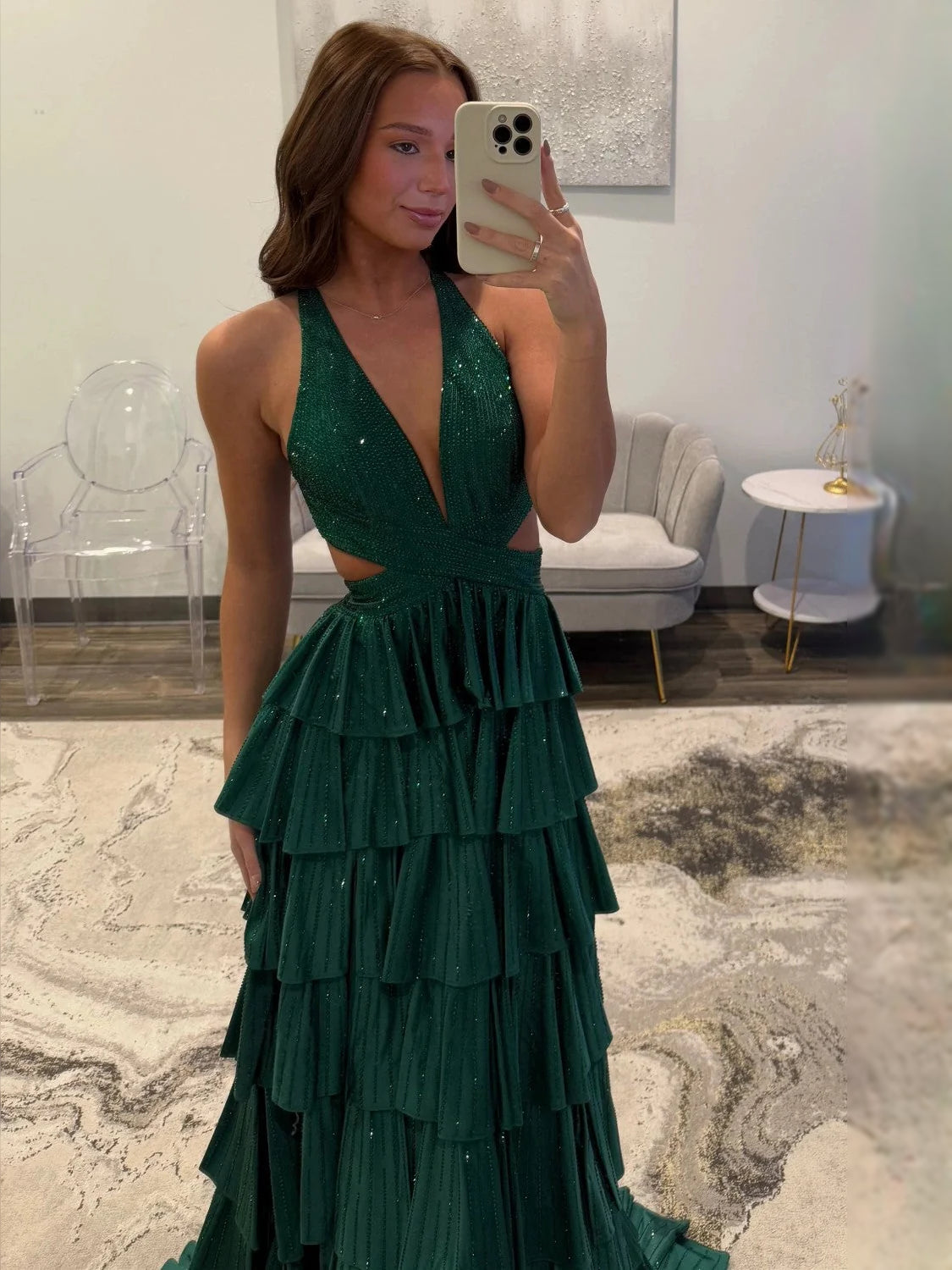 Emerald green V-neck tiered prom dress with beaded sparkle and layered ruffles