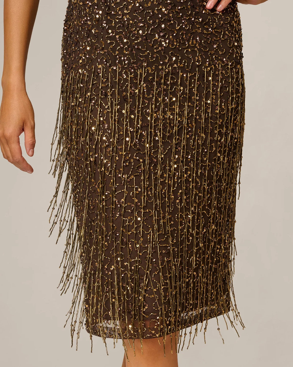 Chocolate A-line midi skirt with vertical sequin strands and fringe hem