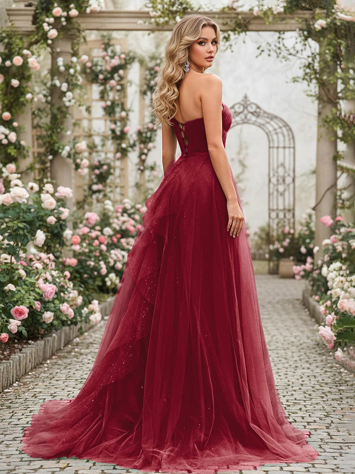 Burgundy one-shoulder corset dress with pleated tulle skirt, floor-length, three-quarter view