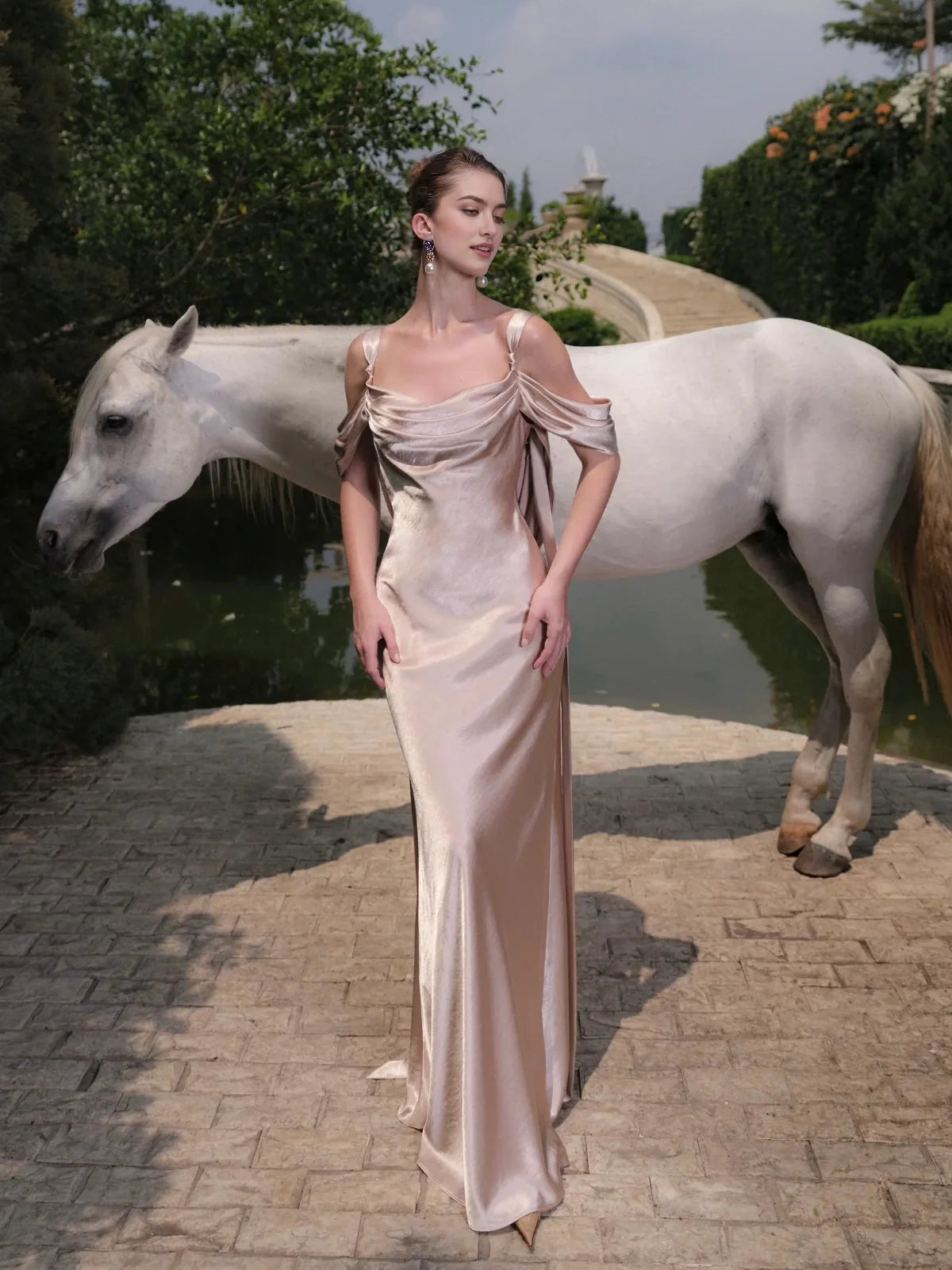 Ivory satin mermaid wedding dress with draped off-shoulder neckline, floor-length