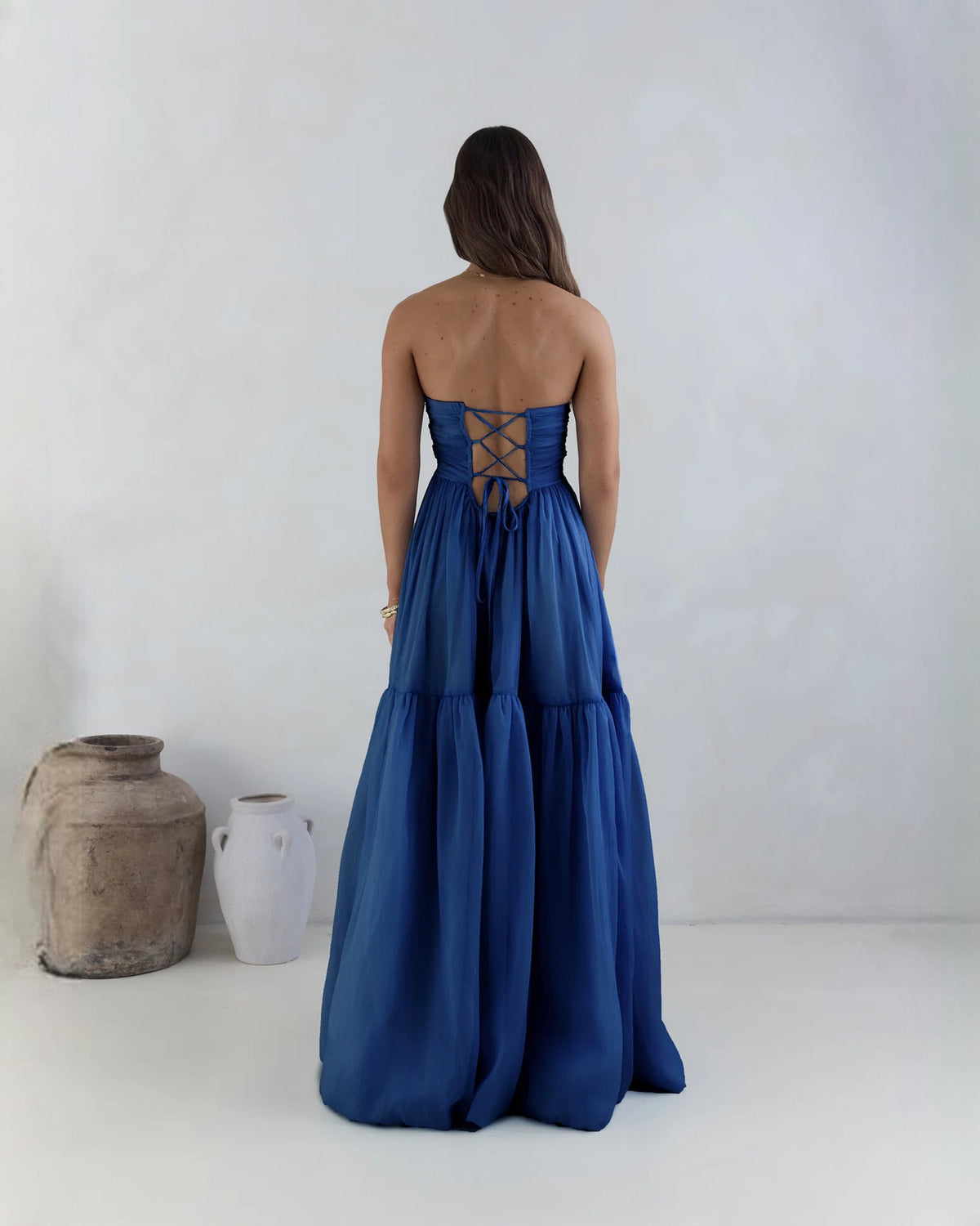 Navy strapless satin maxi dress, open back with crisscross lace-up detail