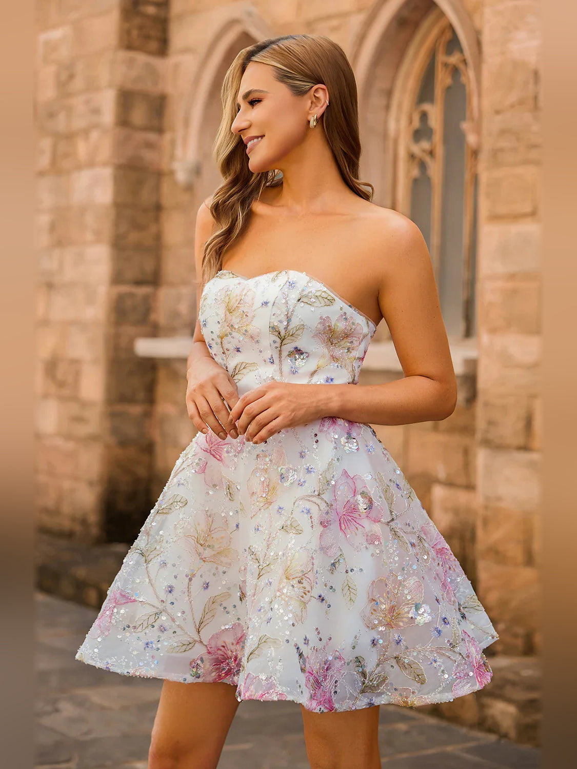 Side view of strapless sweetheart mini tulle dress with floral sequin embroidery, pink