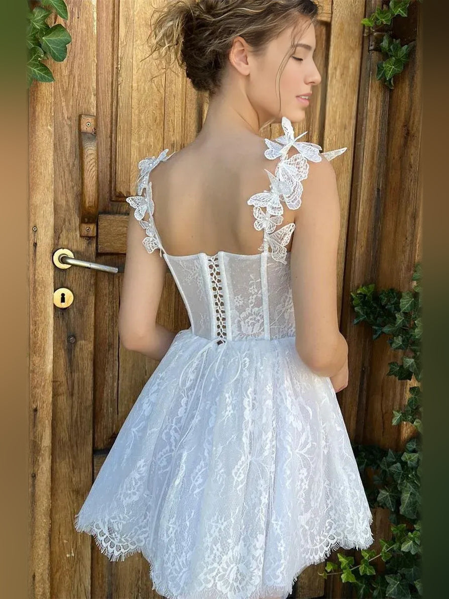 White corset-style A-line short dress with lace back panel and bow strap details