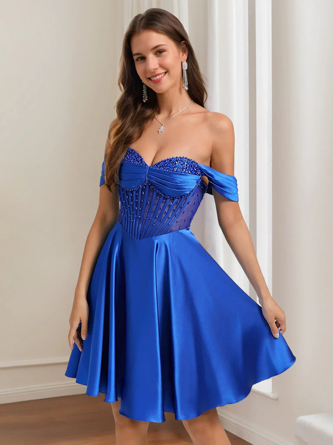 Cobalt blue off-shoulder satin A-line dress with jeweled corset bodice and pleated skirt