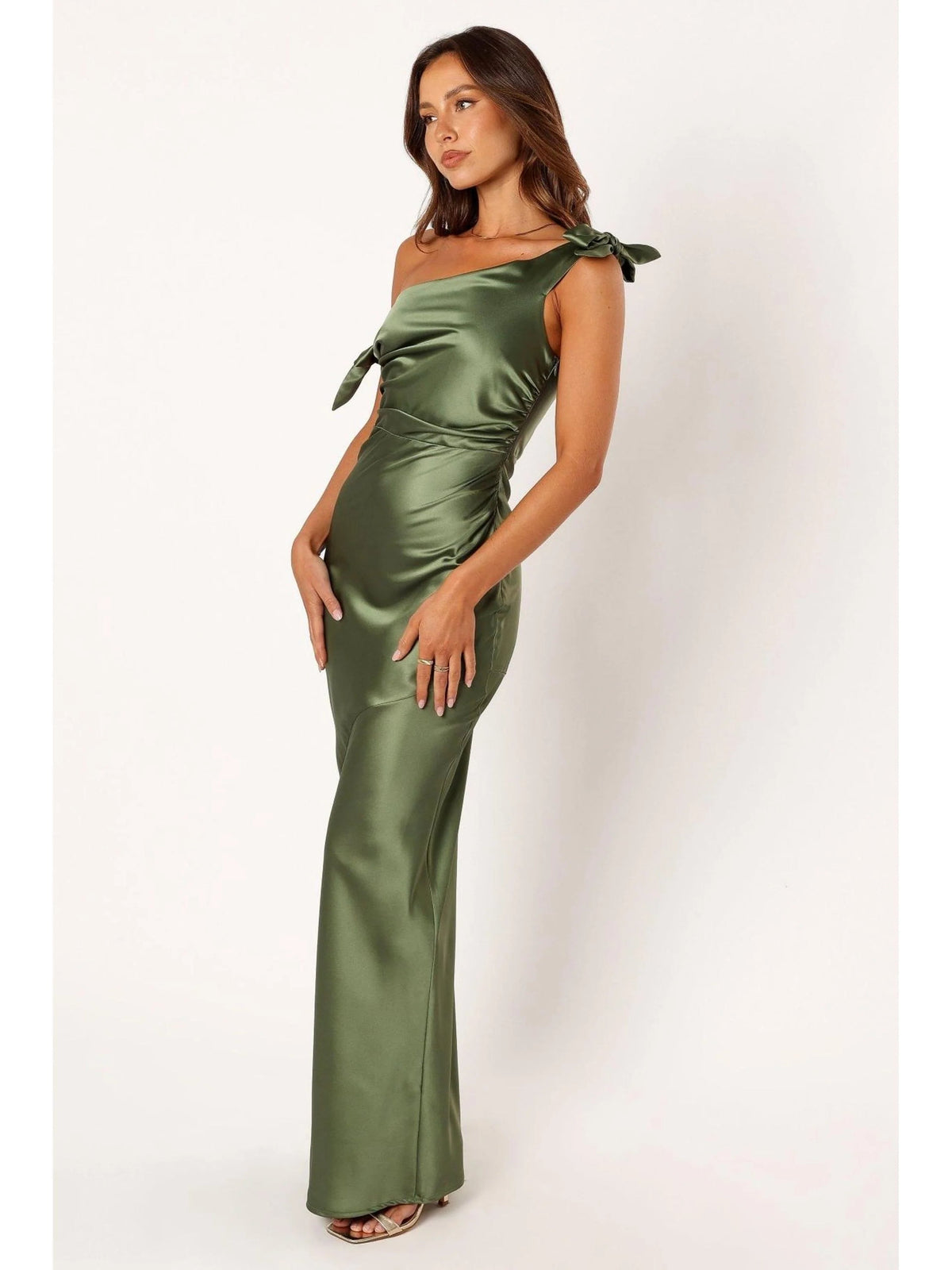 Sage green one-shoulder satin mermaid gown with bow detail and draped ruching